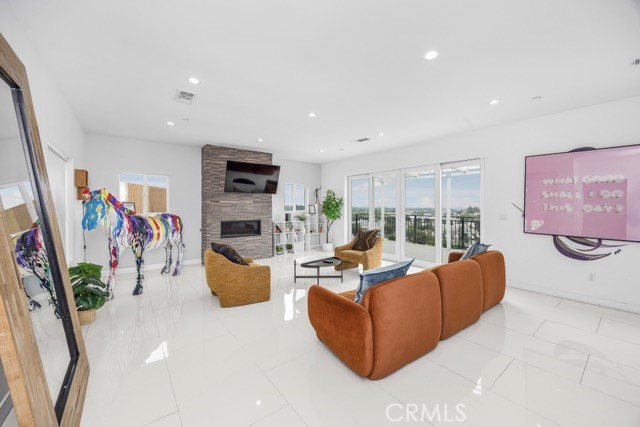 4240 Barrett Road Los Angeles, CA 90032 - Photo 11 of 47 a living room with fireplace furniture and a flat screen tv