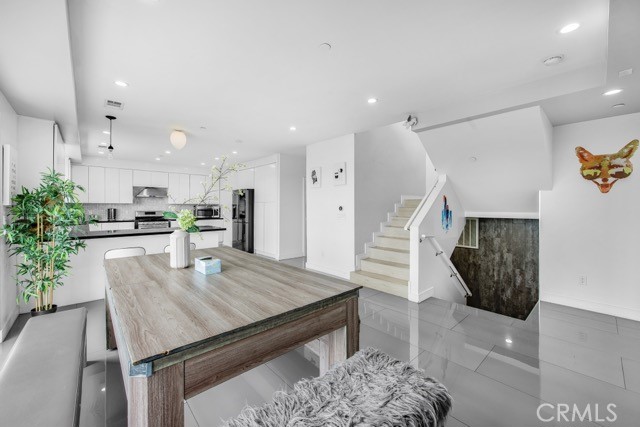 4240 Barrett Road Los Angeles, CA 90032 - Photo 15 of 47 a dining room with furniture and wooden floor