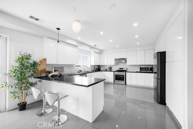 4240 Barrett Road Los Angeles, CA 90032 - Photo 19 of 47 a kitchen with counter top space and appliances