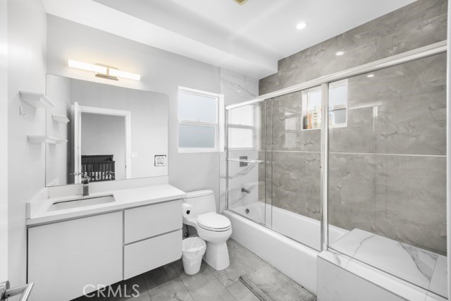 4240 Barrett Road Los Angeles, CA 90032 - Photo 25 of 47 a bathroom with a shower sink vanity mirror and toilet