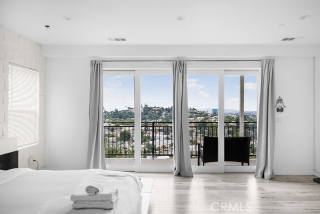 4240 Barrett Road Los Angeles, CA 90032 - Photo 28 of 47 a living room with a large window and a wooden floor