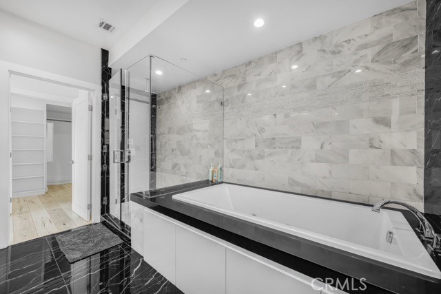 4240 Barrett Road Los Angeles, CA 90032 - Photo 31 of 47 a bathroom with a bathtub and a shower