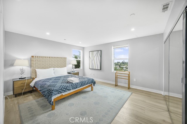 4240 Barrett Road Los Angeles, CA 90032 - Photo 37 of 47 a bedroom with a bed and dresser with mirror