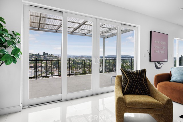 4240 Barrett Road Los Angeles, CA 90032 - Photo 10 of 47 a living room with furniture and a floor to ceiling window