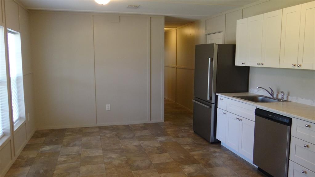 4722 Odneal Road Krum, TX 76249 - Photo 3 of 13 Eatin kitchen; living area.