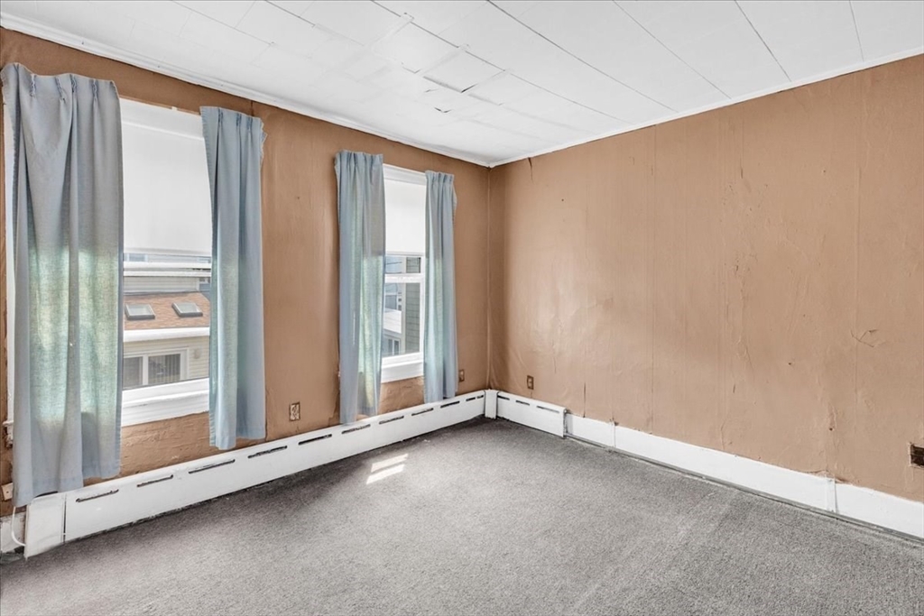 4 Springer Street Boston, MA 02127 - Photo 9 of 18 a view of an empty room with a window