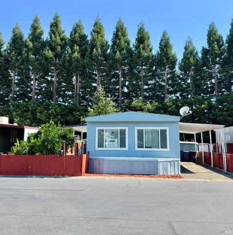 a view of house with outdoor space and tree s