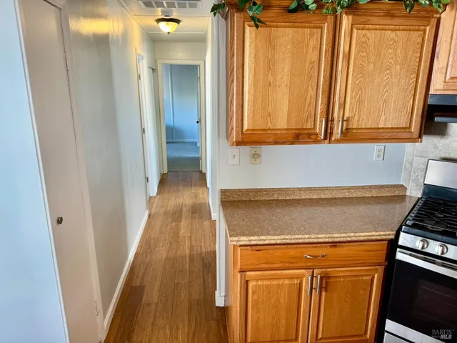 a room with wooden floor and a window