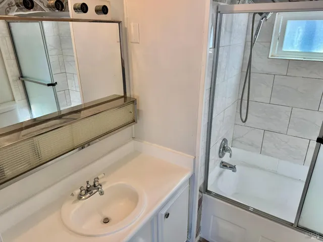 a bathroom with a sink and a mirror