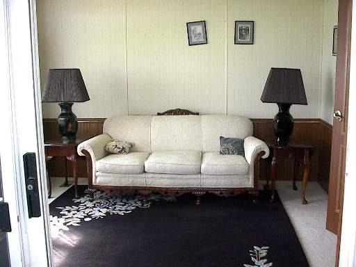 746 Moffet Road Paw Paw, IL 61353 - Photo 3 of 8 a living room with furniture and a lamp