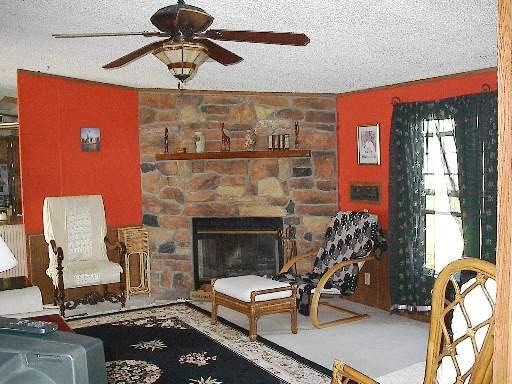 746 Moffet Road Paw Paw, IL 61353 - Photo 5 of 8 a living room with furniture and a fireplace
