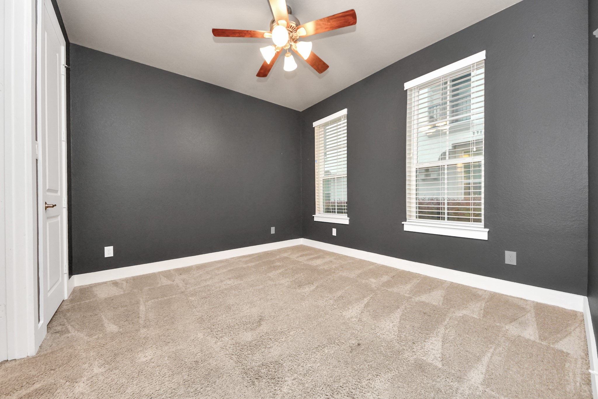 2704 Freund Street Houston, TX 77003 - Photo 5 of 45 a view of an empty room with window and chandelier fan