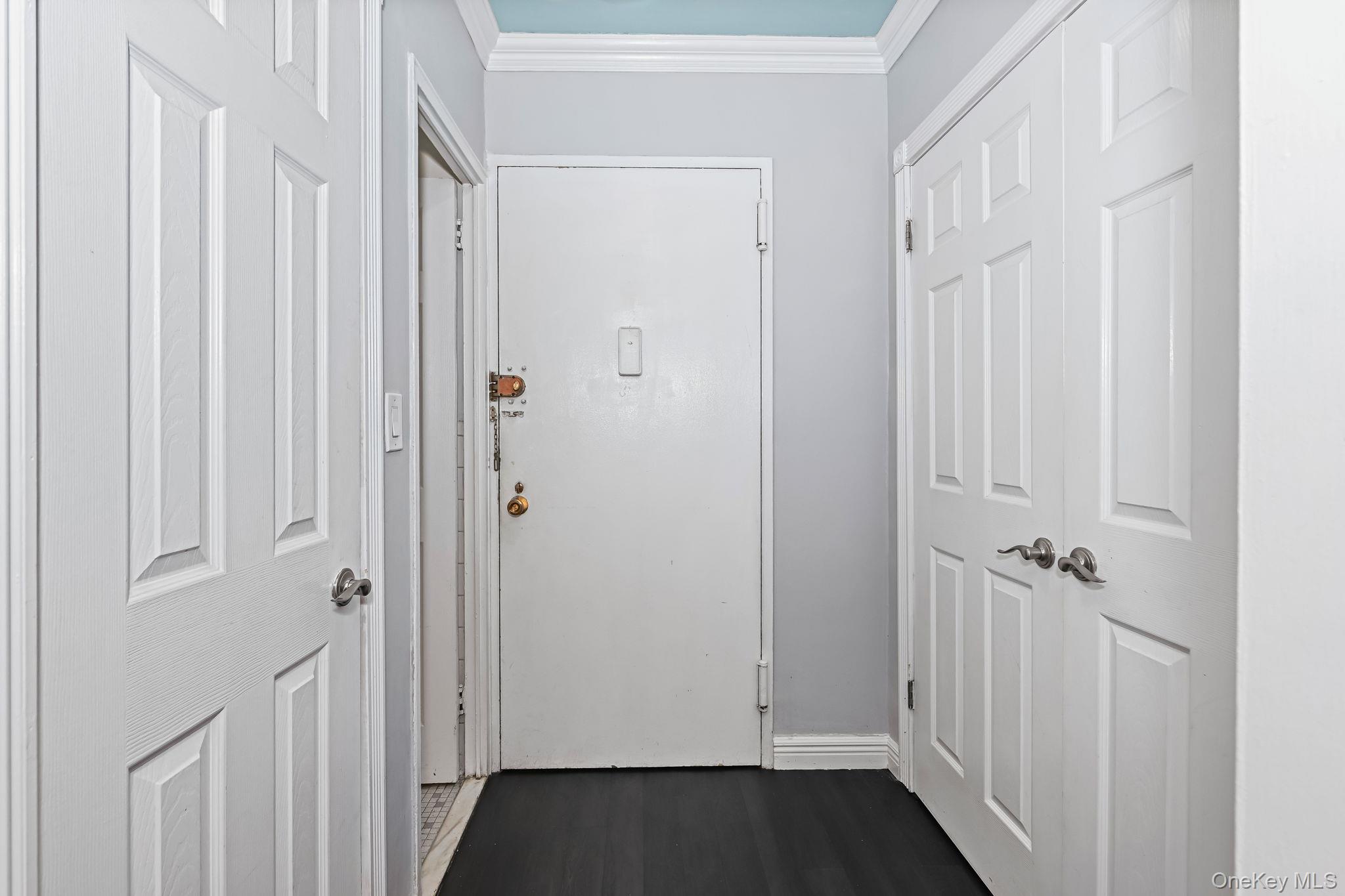 260 Garth Road, Unit 3K4 Scarsdale, NY 10583 - Photo 9 of 18 Front door, coat closet and storage closet
