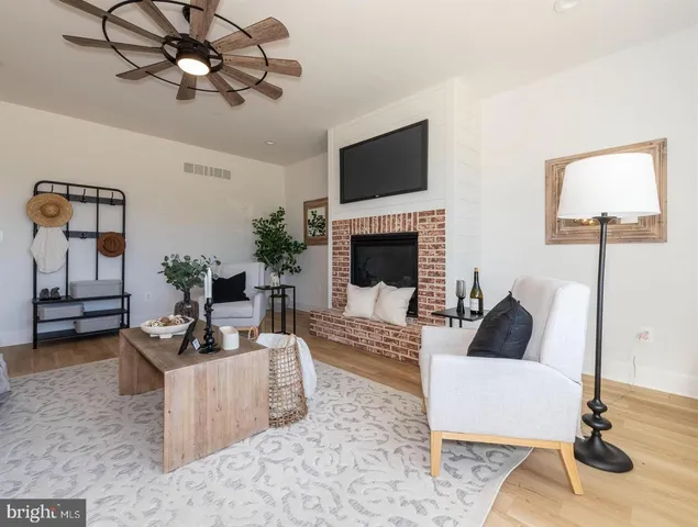 a view of kitchen with cabinets and wooden floor
