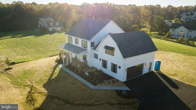 a aerial view of a house with a yard