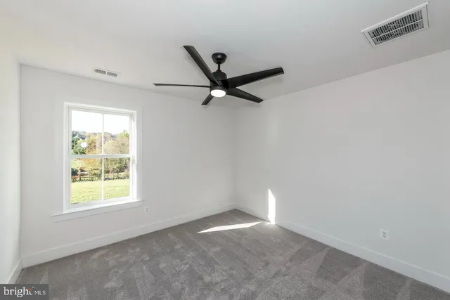 a view of a big room with a fireplace