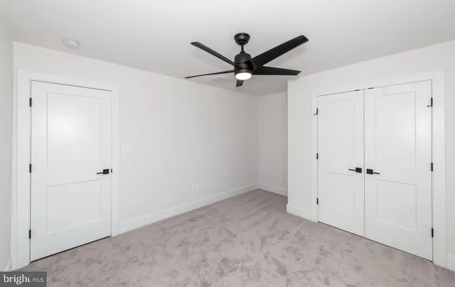 a view of a street with stores