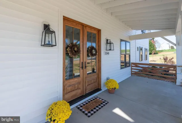a living room with furniture and a gate