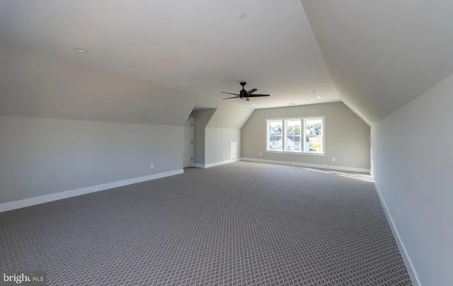 a front view of a house with a yard outdoor seating and garage