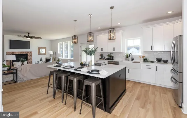 a kitchen with stainless steel appliances a stove and refrigerator