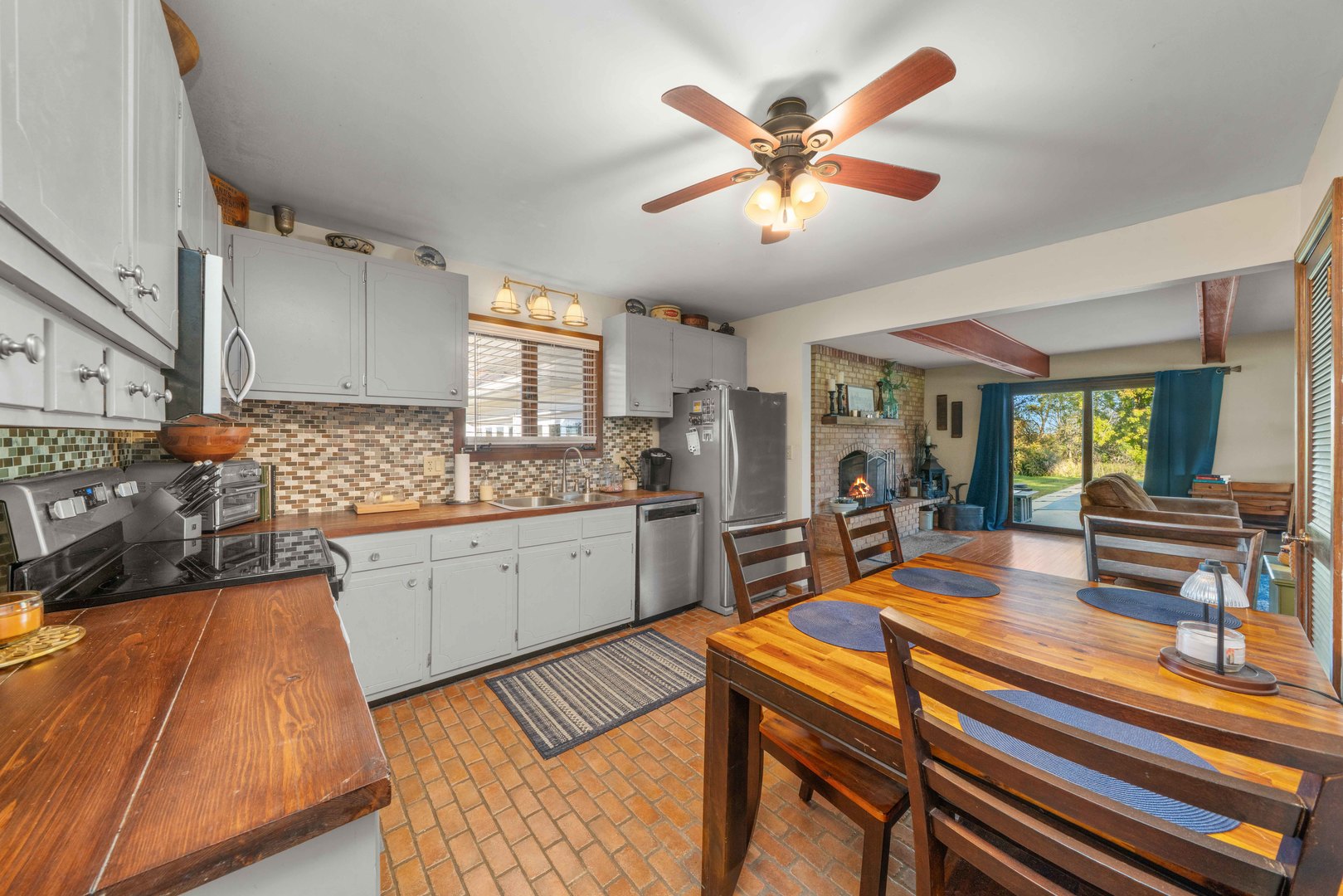 10266 Pritchard Road Hinckley, IL 60520 - Photo 12 of 41 a kitchen with stainless steel appliances granite countertop a sink and cabinets