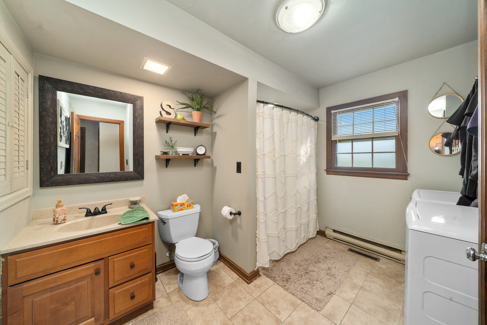 10266 Pritchard Road Hinckley, IL 60520 - Photo 13 of 41 a bathroom with a toilet sink and mirror