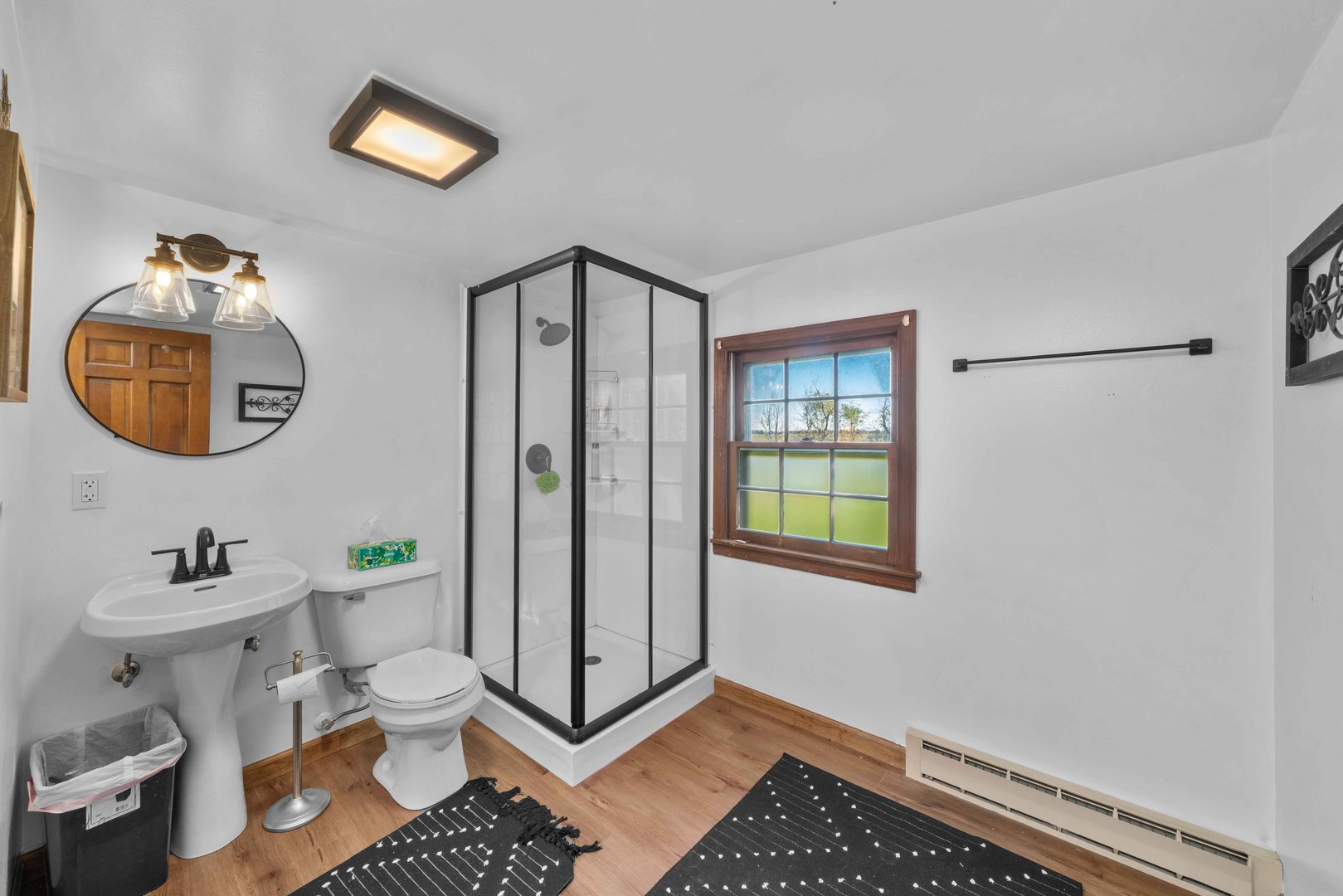 10266 Pritchard Road Hinckley, IL 60520 - Photo 19 of 41 a bathroom with a toilet a sink and mirror