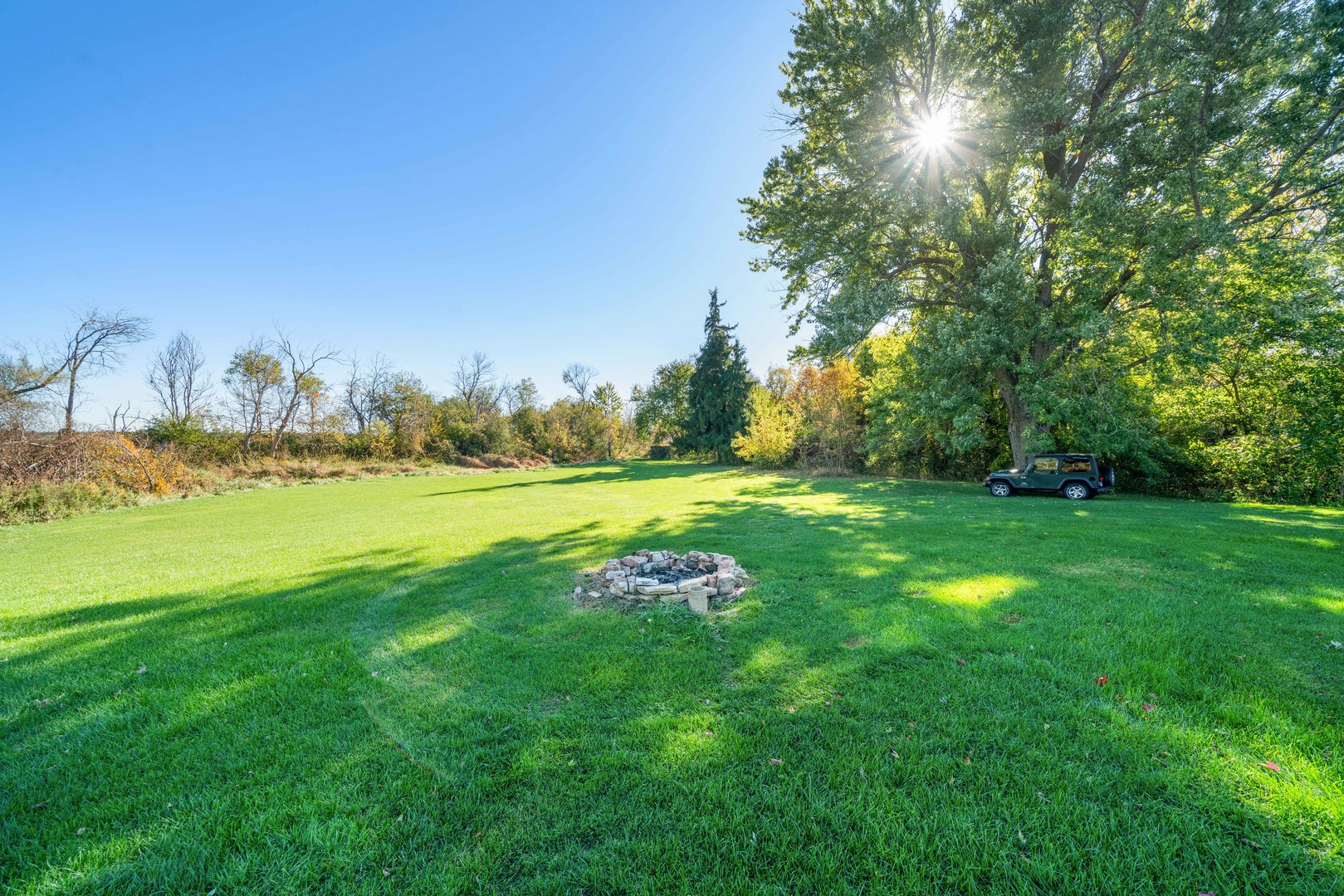 10266 Pritchard Road Hinckley, IL 60520 - Photo 28 of 41 a green field with lots of trees in the background
