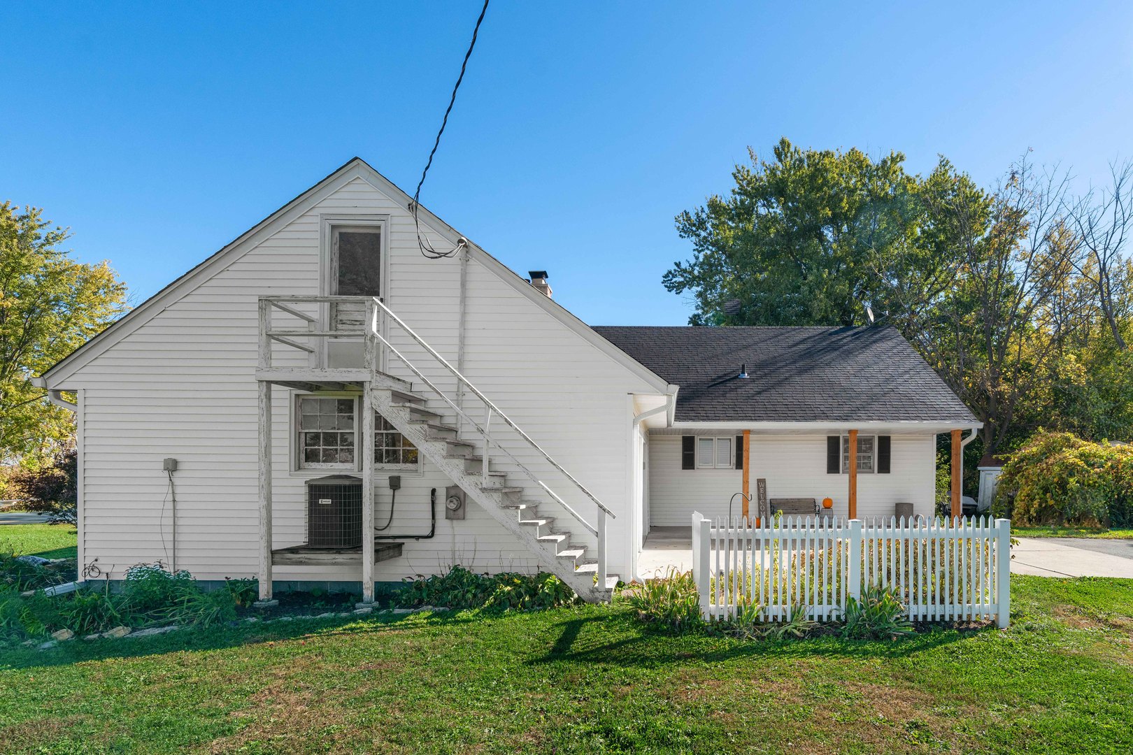 10266 Pritchard Road Hinckley, IL 60520 - Photo 3 of 41 a front view of a house with a yard and trees