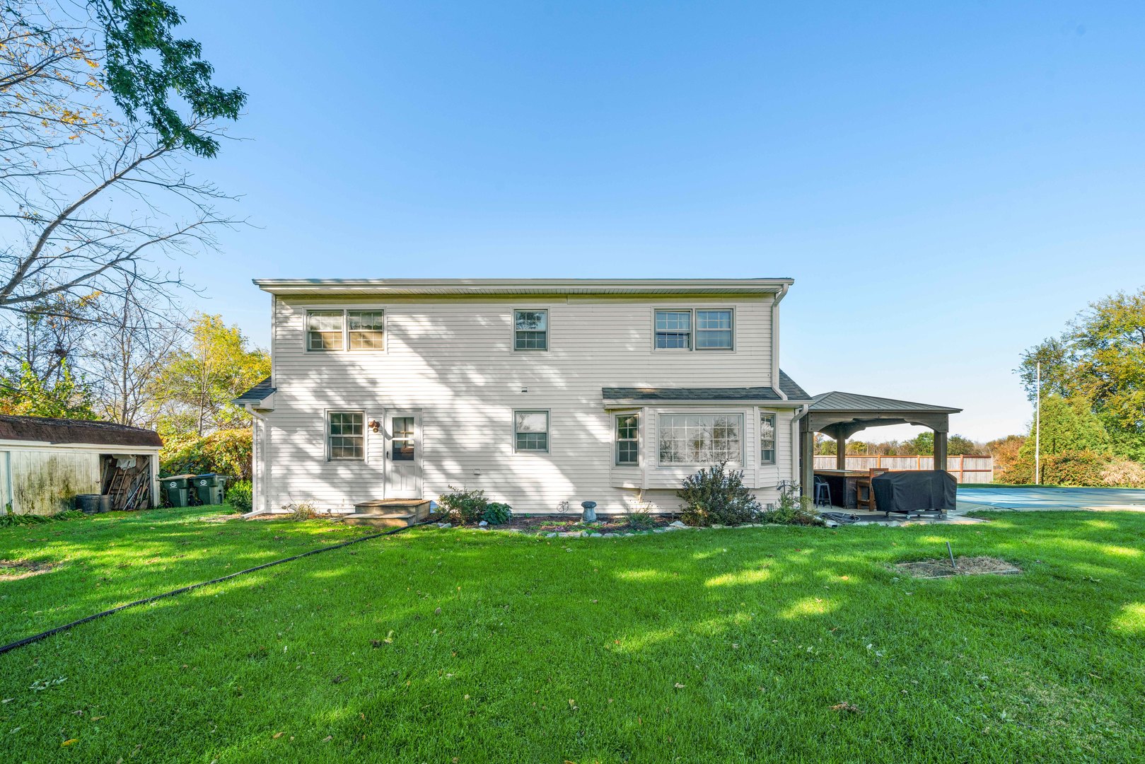 10266 Pritchard Road Hinckley, IL 60520 - Photo 32 of 41 a front view of a house with garden