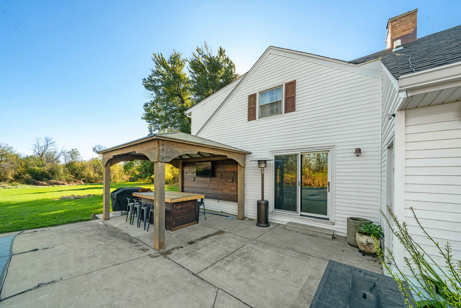 10266 Pritchard Road Hinckley, IL 60520 - Photo 35 of 41 a backyard of a house with table and chairs
