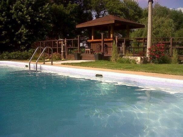 10266 Pritchard Road Hinckley, IL 60520 - Photo 38 of 41 a view of pool with table and chairs under an umbrella
