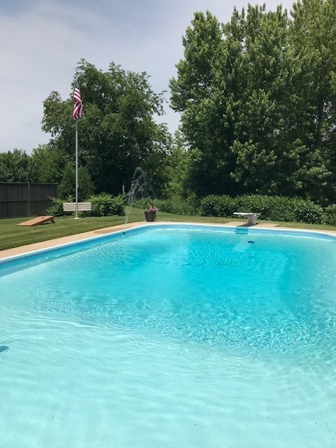 10266 Pritchard Road Hinckley, IL 60520 - Photo 39 of 41 a view of a swimming pool with an outdoor space and seating area