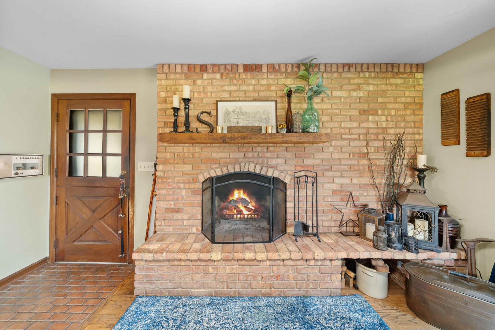 10266 Pritchard Road Hinckley, IL 60520 - Photo 9 of 41 a living room with a fireplace and a rug