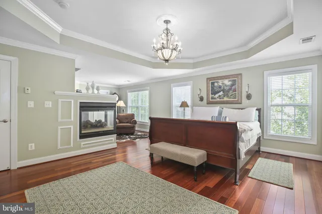 a bedroom with furniture and a fireplace
