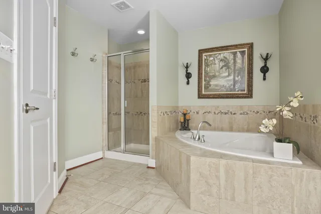 a view of walk in closet with window and outdoor view