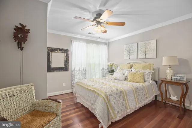 a bedroom with a bed and a chair