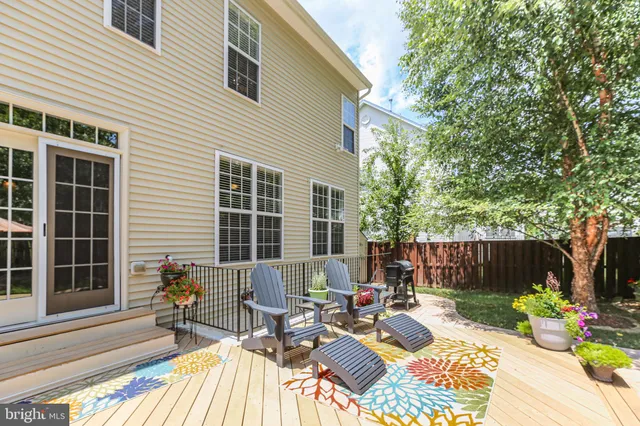 a view of a chair and tables in the backyard