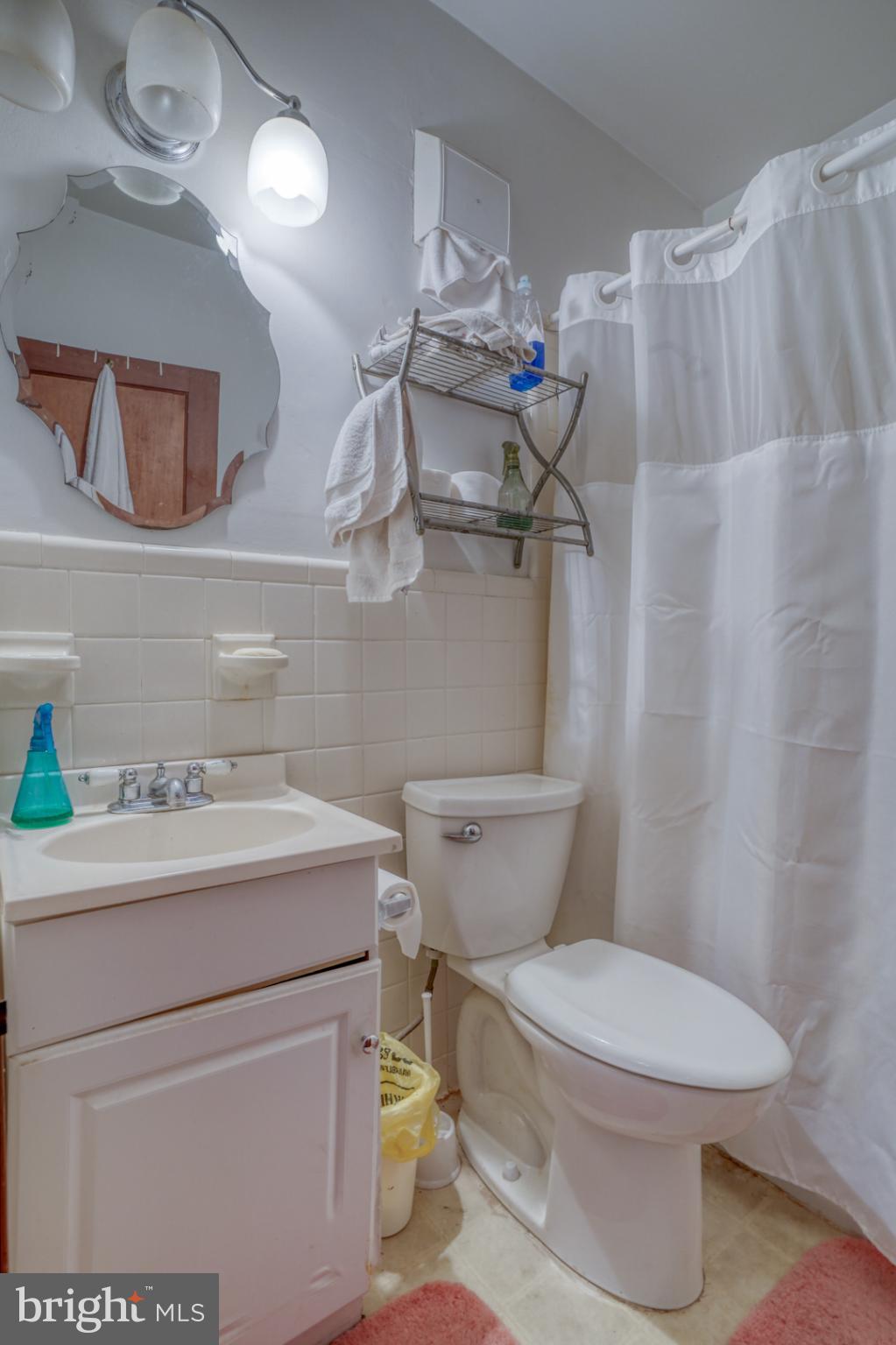 4096 Main Street Trappe, MD 21673 - Photo 41 of 70 a white toilet sitting next to a bathroom sink