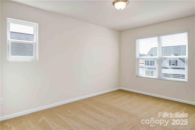 9740 Weikert Road Charlotte, NC 28215 - Photo 11 of 16 an empty room with a window