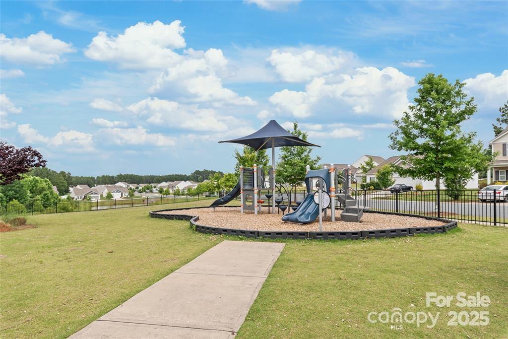 9740 Weikert Road Charlotte, NC 28215 - Photo 15 of 16 a view of a swimming pool with a terrace