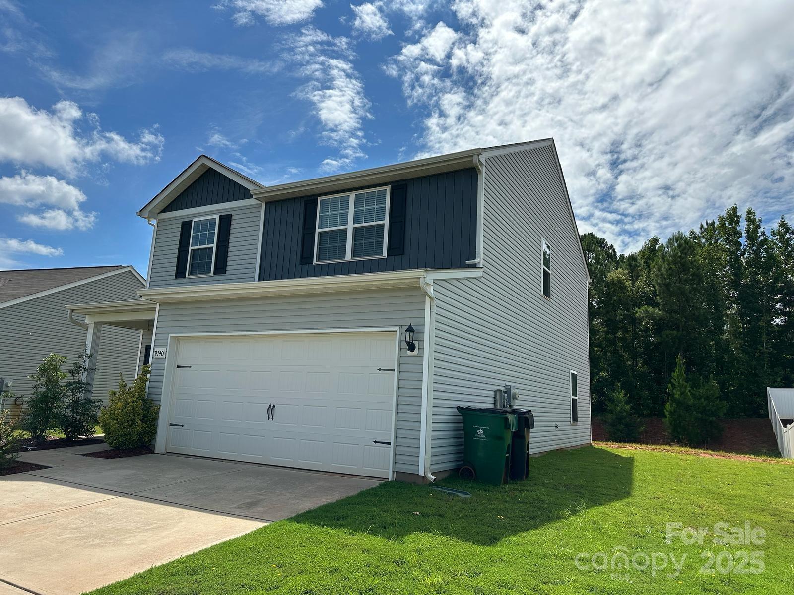 9740 Weikert Road Charlotte, NC 28215 - Photo 2 of 16 a house view with a garden space