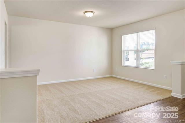 9740 Weikert Road Charlotte, NC 28215 - Photo 4 of 16 an empty room with windows