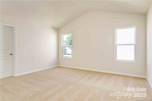 9740 Weikert Road Charlotte, NC 28215 - Photo 9 of 16 an empty room with windows