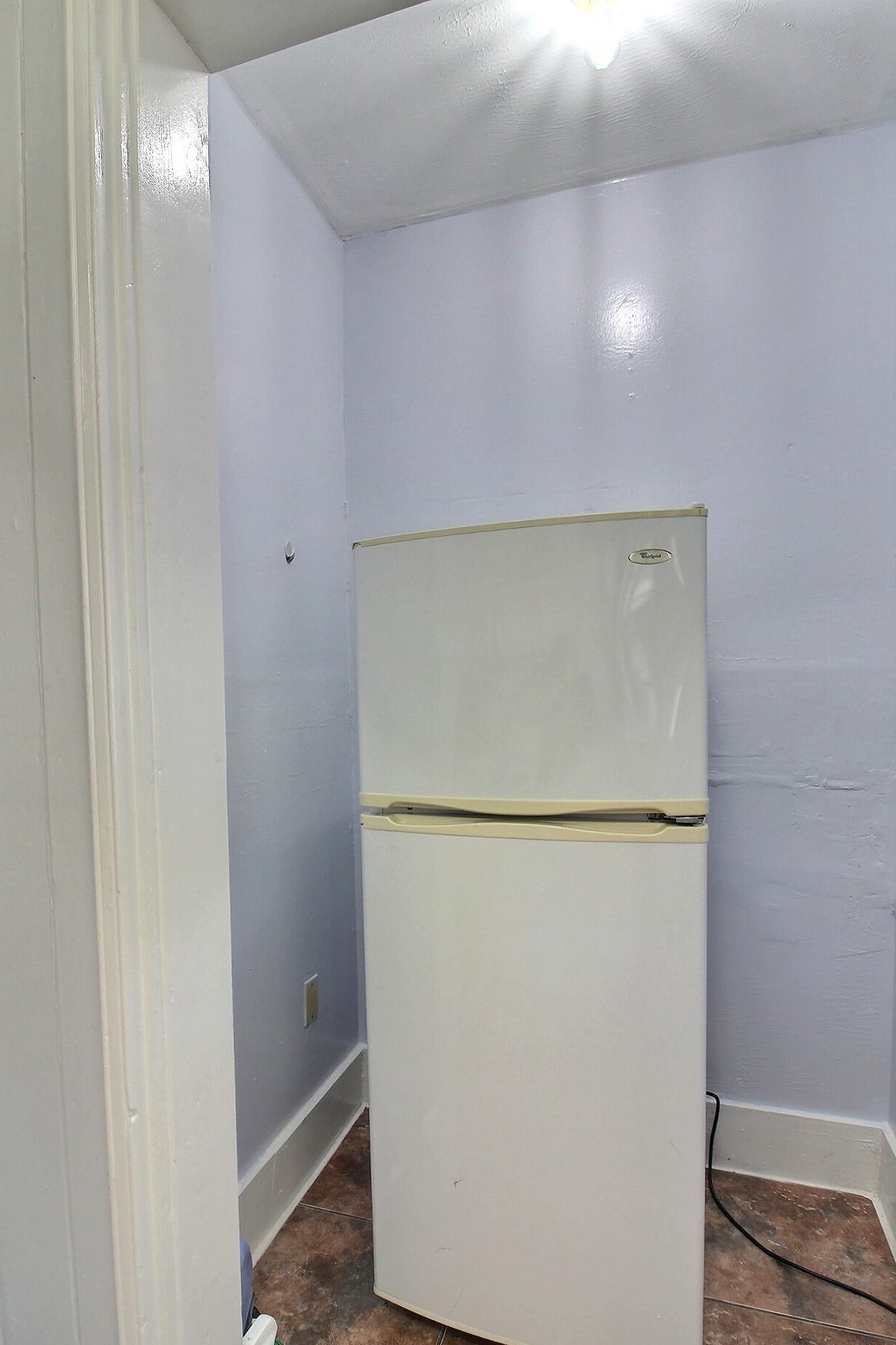 4528 Quince Road Memphis, TN 38117 - Photo 13 of 27 a view of storage and utility room with washer and dryer