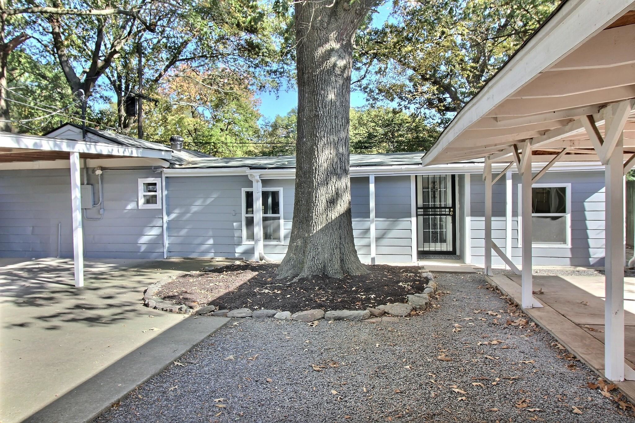 4528 Quince Road Memphis, TN 38117 - Photo 15 of 27 a front view of a house with a yard