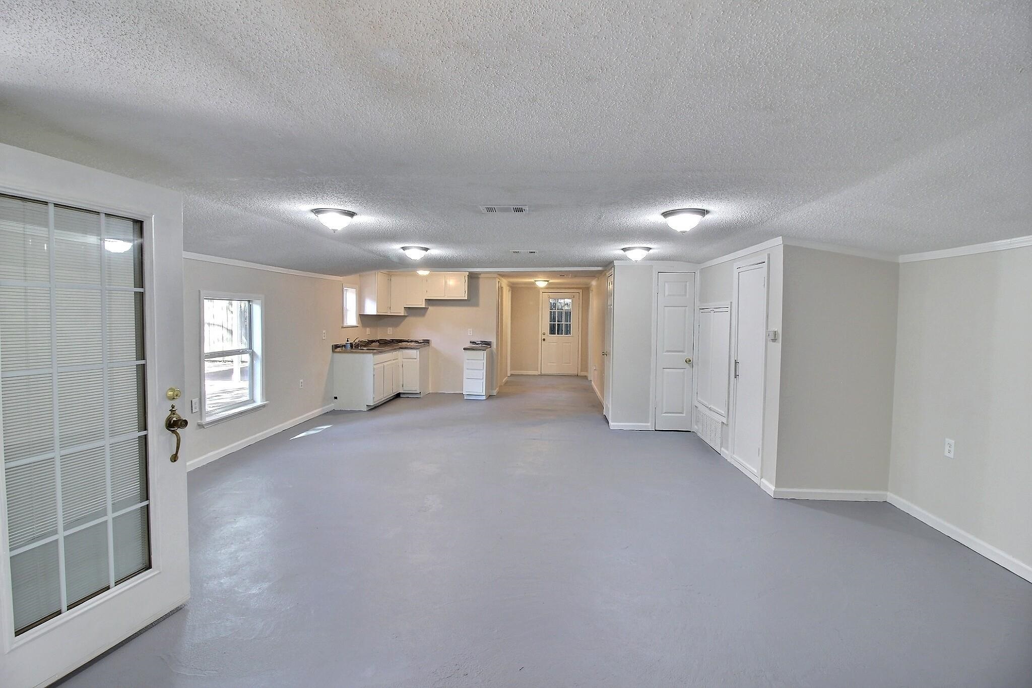 4528 Quince Road Memphis, TN 38117 - Photo 16 of 27 a view of a big room with windows and cabinet
