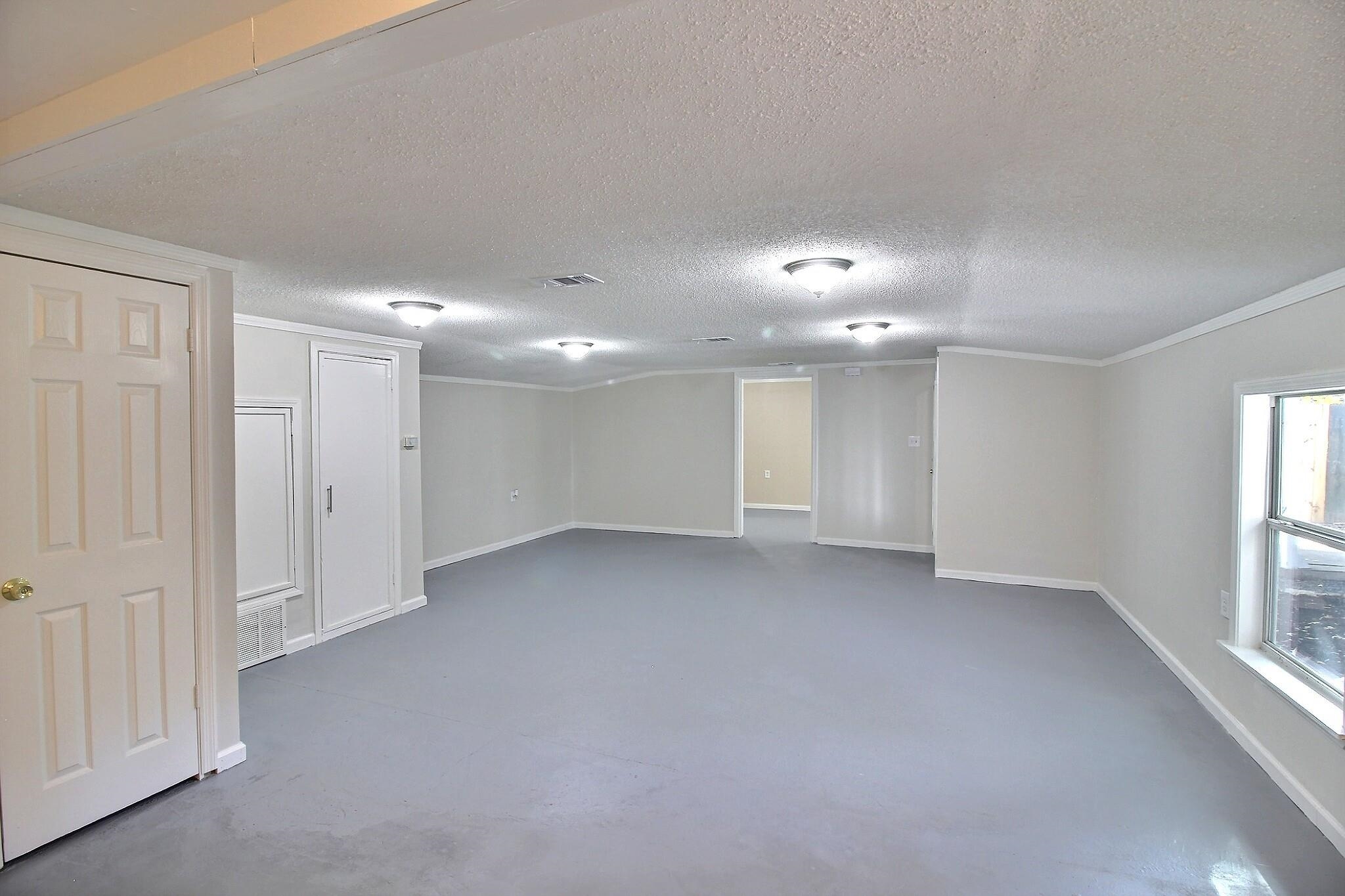 4528 Quince Road Memphis, TN 38117 - Photo 18 of 27 a view of an empty room with a window