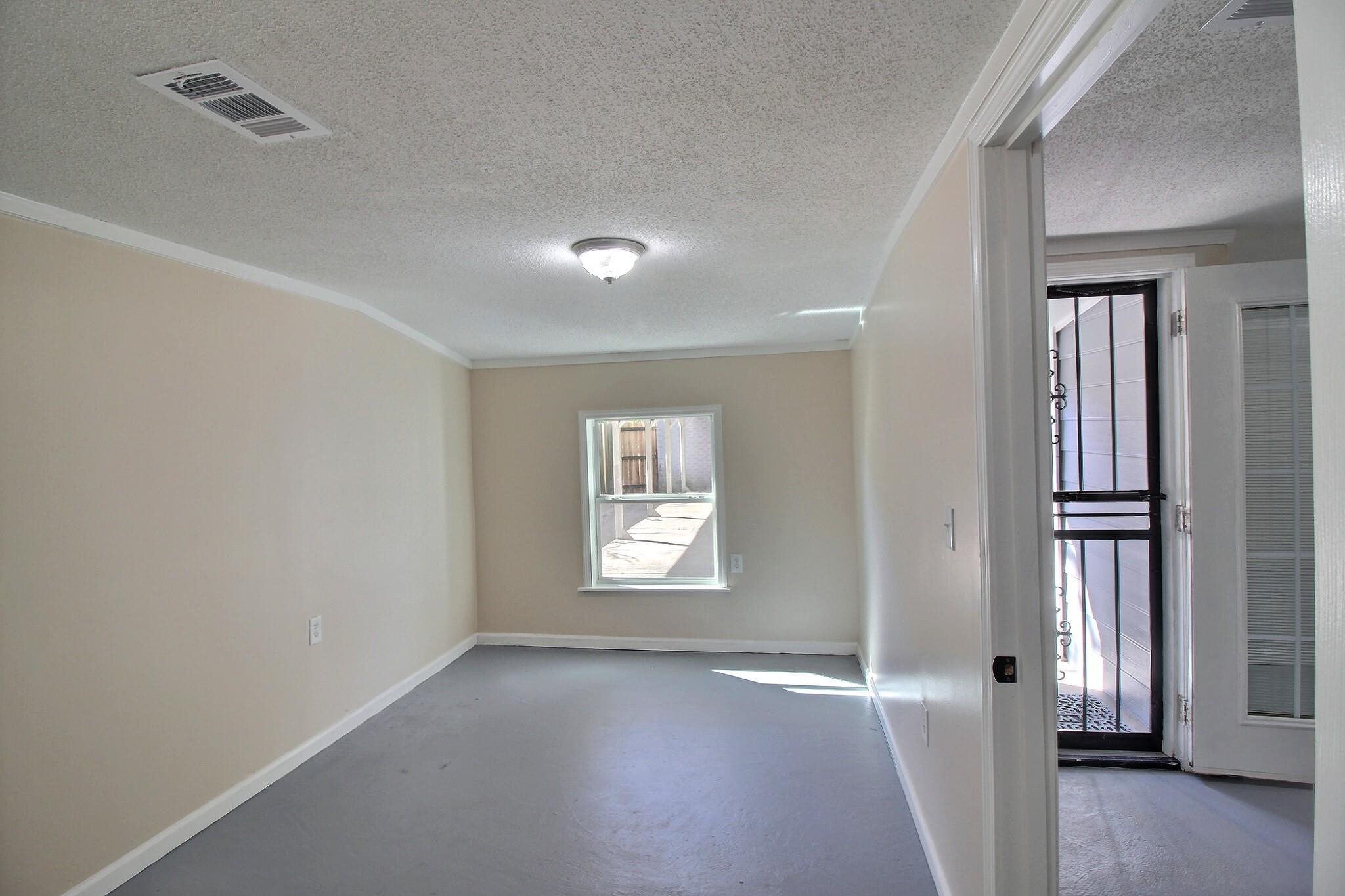 4528 Quince Road Memphis, TN 38117 - Photo 24 of 27 an empty room with windows and closet