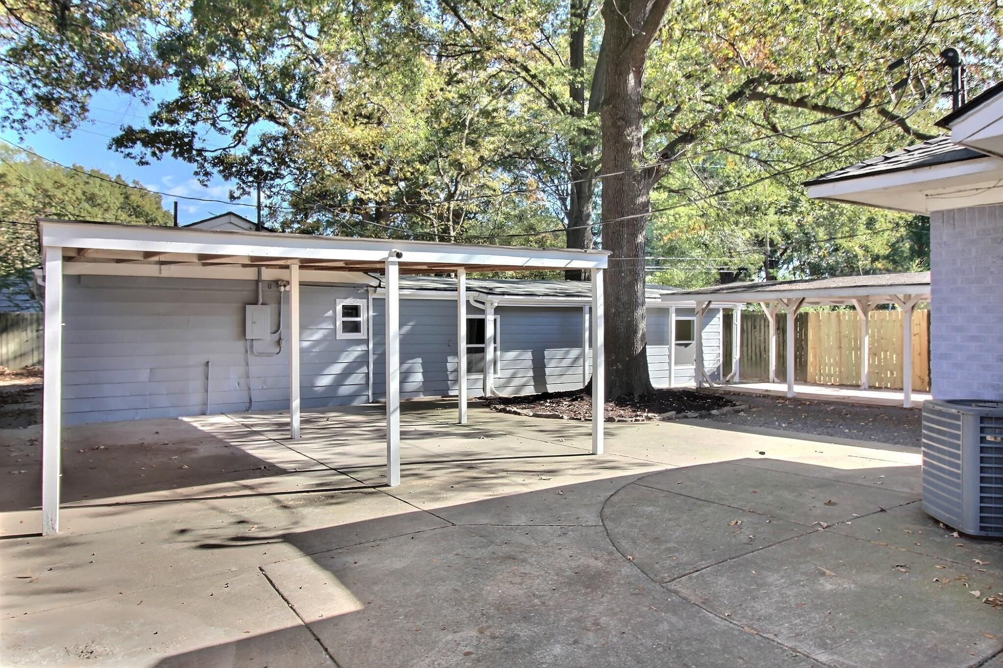 4528 Quince Road Memphis, TN 38117 - Photo 27 of 27 a backyard of a house with table and chairs